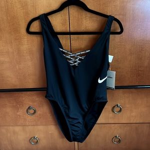 New with tags and panty liner in suit! Black Nike one piece swim xl